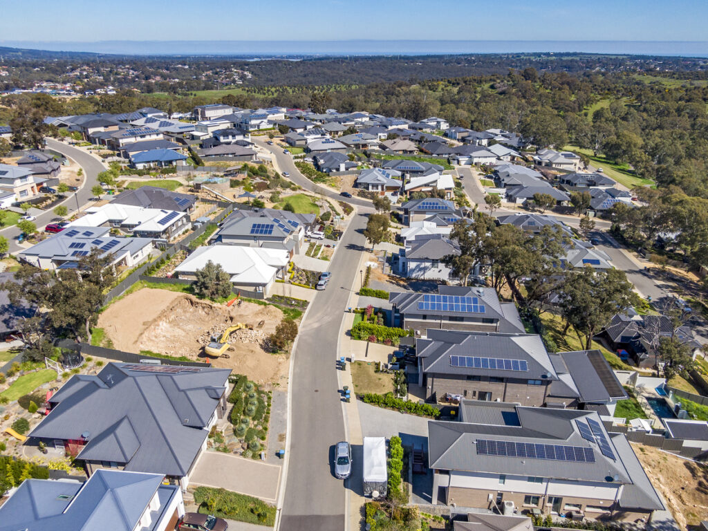 Aerial view of new homes on sloping ground